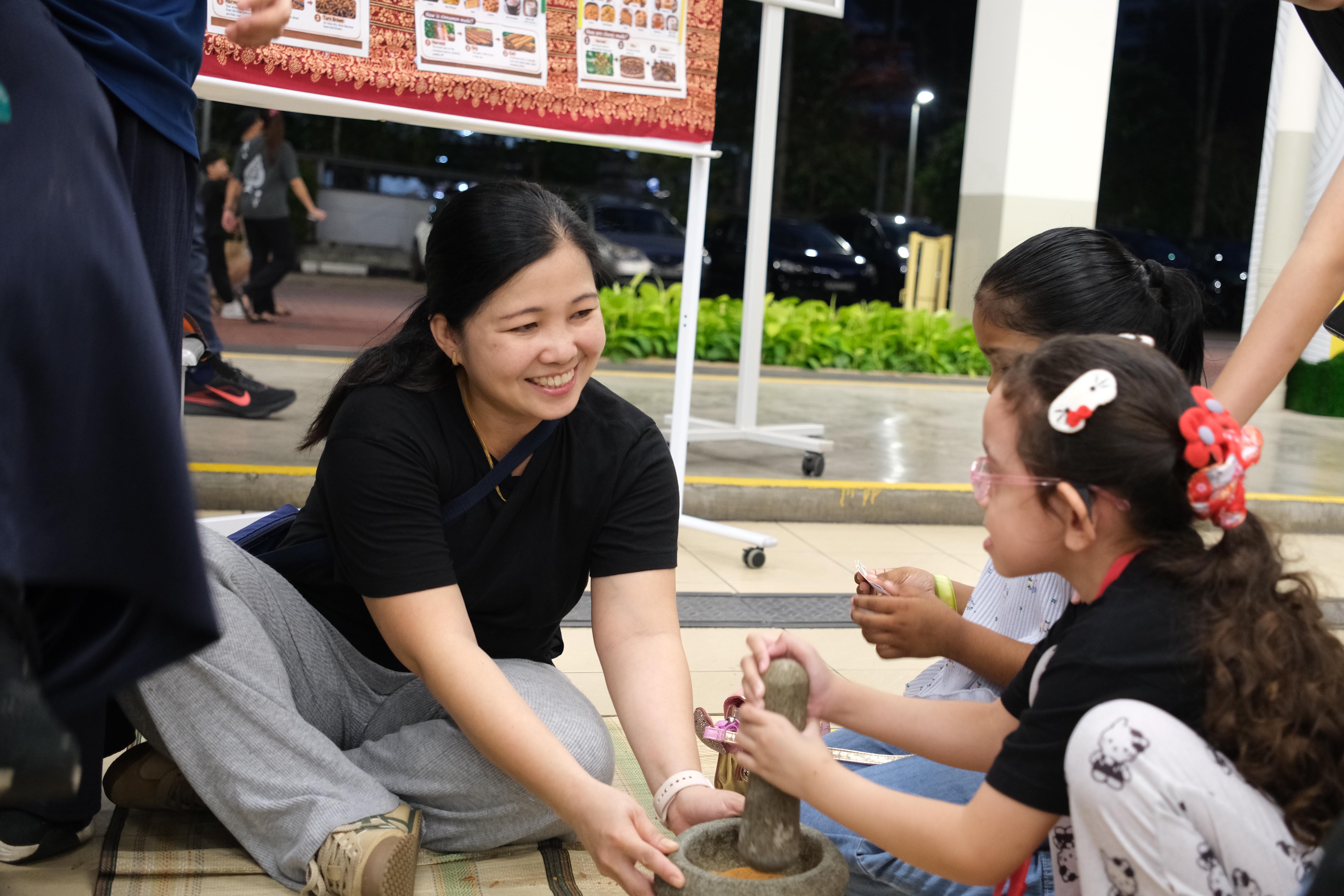 Learning culture hands-on! Families have fun discovering traditional ways of preparing food together.
